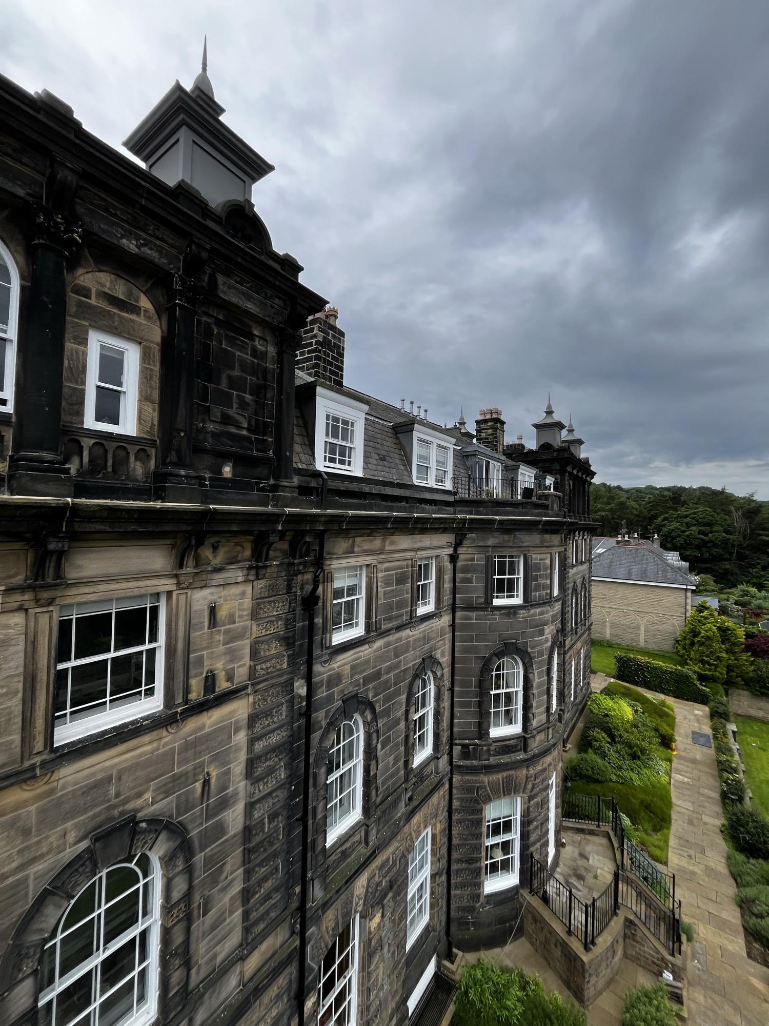Heritage lime mortar repointing on the cornice of Wells House, Ilkley - specialist high-level stonework by Northern Seal & Joint.